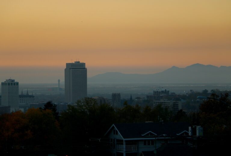 Cityscape of Salt Lake City, Utah, of sunset obstructed by poor air quality and smog.